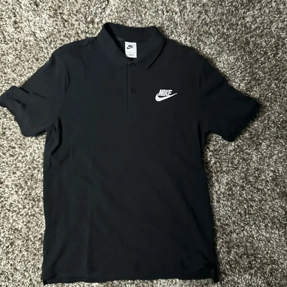 Nike Men's Black Polo Shirt with White Swoosh and NIKE Lettering Size Large